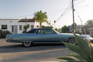 Side view of a classic vintage American car in a parking lot in LA