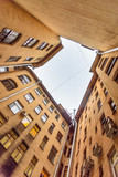 Fototapeta Niebo - Courtyard-well. The bottom view upwards. Saint Petersburg, Russia