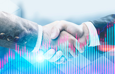 Handshake of two businessmen, blurred city, graph