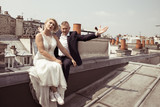 Fototapeta Paryż - bride and groom on the roof