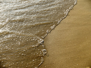 The beach sand and wave sea background