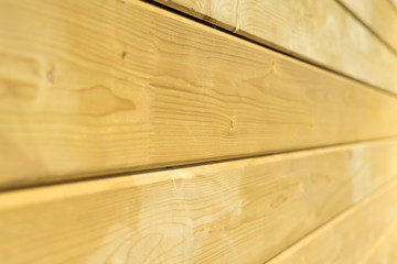 Photo wall of a wooden house made of wooden beams.