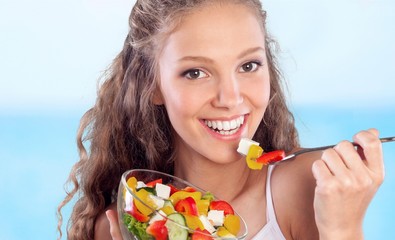 Poster - Attractive caucasian smiling woman with salad