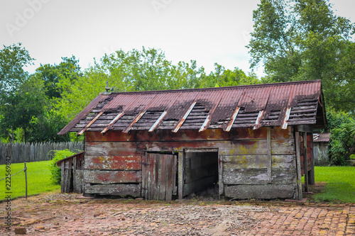 Isolated Image Of Worn Barn Wood Abandoned Slave Cabin With