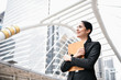 © S photographer - Business concept. Young businesswoman is working in business district. Young businesswoman happy to work.