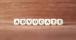 Word ADVOCATE made with wood building blocks