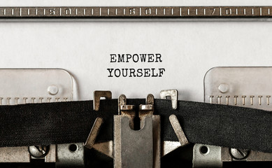 Wall Mural - text empower yourself typed on retro typewriter