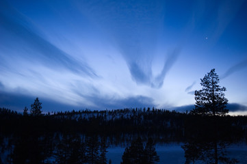 Wall Mural - twilight winter landscape. stars appear in the sky.