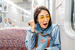 sleepy woman yawn in train or metro, sleepless and insomnia concept