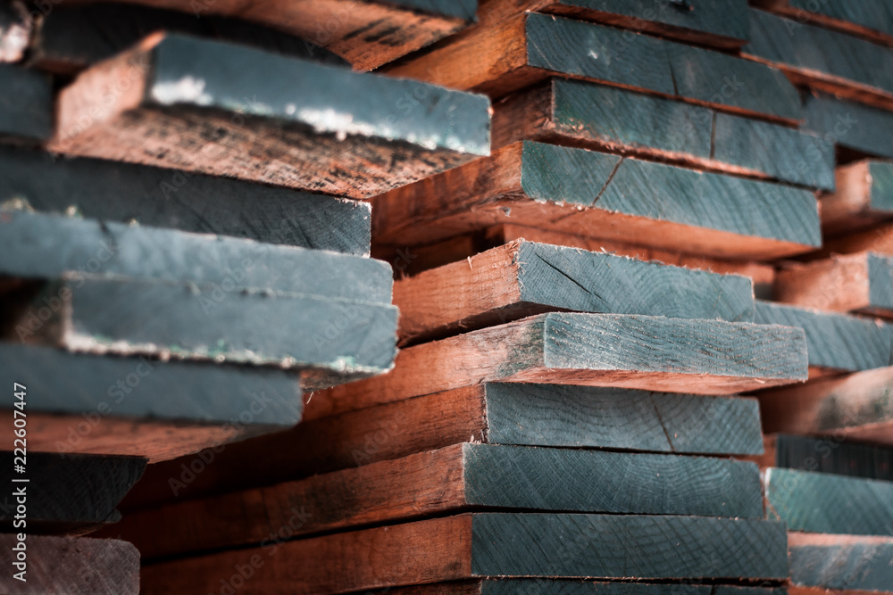 Close up macro shot of premium quality wood planks, pile up in a stack of materials ready for export and sell on European markets.  rady  - obrazy, fototapety, plakaty 
