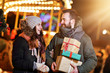 © Kalim - Adult couple shopping in the city during Christmas time