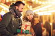 © Kalim - Adult couple shopping in the city during Christmas time