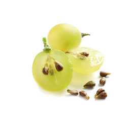 Cut and whole fresh ripe juicy grapes with seeds on white background