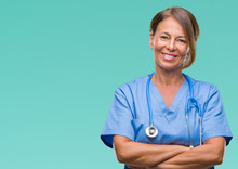 Middle Age Senior Nurse Doctor Woman Over Isolated Background Happy Face Smiling With Crossed Arms Looking At The Camera. Positive Person.