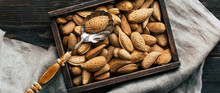 Almonds, Shell Nuts In A Box On A Wooden Background, Autumn Still Life