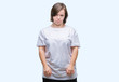 © Krakenimages.com - Young adult woman with down syndrome over isolated background depressed and worry for distress, crying angry and afraid. Sad expression.