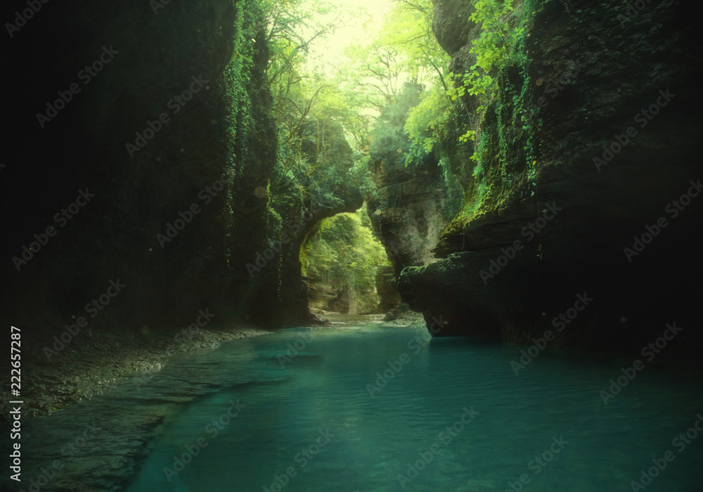 art photo. fairy backgroud. green wild virgin nature. journey to Georgia, travelling to Martvili canyon. mountain lake, fantastic place. Beautiful vines hanging down to the blue water from the cliff. - obrazy, fototapety, plakaty 