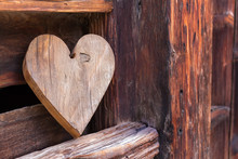 Wooden Heart Outside Of A Rustical Barn As A Sign For Welcome