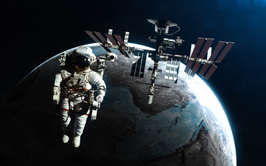 Wall Mural - astronaut and space station against background of exoplanet in rays of blue star. abstract science f