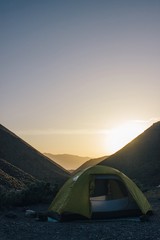 Wall Mural - tent in the mountains during a sunset