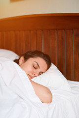 Wall Mural - Deep sleeping brunette woman