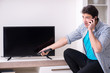 © Elnur - Man trying to fix broken tv