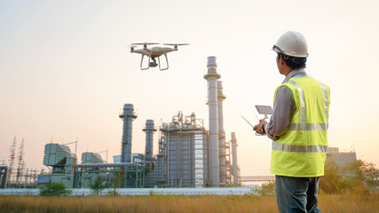 drone inspection. operator inspecting construction building turbine power plant