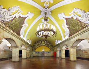 MOSCOW - AUGUST 8, 2018: Train at the metro station Komsomolskaya at night in Moscow, Russia. Komsomolskaya subway is a great example of the Soviet design. Luxurious underground landmark of Moscow.