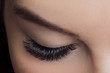 © Parilov - Woman with long lashes in beauty salon. Concept eyelash extension procedure.