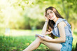 © F8  \ Suport Ukraine - Young woman reading book under the tree in park
