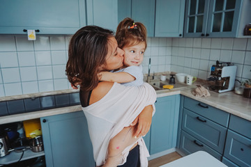 Mom and little daughter having fun together