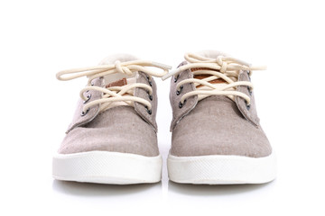 Close up of kids sneakers on white background