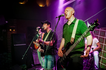 Wall Mural - Band performs on stage in a nightclub