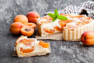 Wall Mural - Homemade  cheese cake with apricot on wooden table