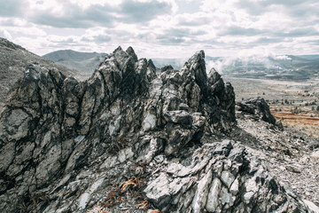 The dirtiest city, with a terrible landscape and plant. The problem of ecology and mountains of industrial waste. Coal rocks