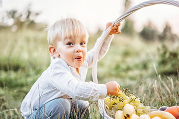 Wall Mural - Pretty little baby boy have fun outdoor