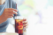 Closeup Woman Hand Holding Glass Of Cola Drink In Restaurant Background, Woman Hand Glass Soft Drinks With Ice