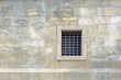 © Николай Батаев - The old wall of stone blocks with a lattice window