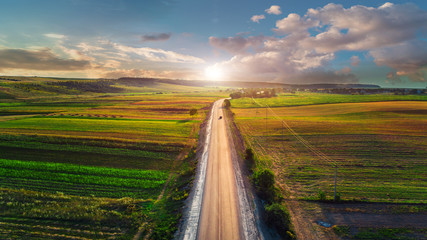 Wall Mural - Aerial shot of car on the road from drone point of view