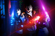 © JackF - Young people with laser pistols in bright beams