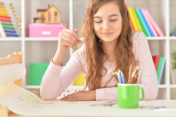 Portrait of Teenage girl drawing at hom