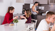 © JackF - Female travelers planning itinerary in hostel kitchen