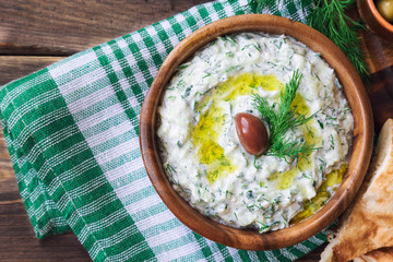 Poster - Tzatziki sauce in wooden bowl