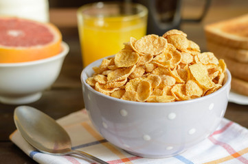 Corn flakes, or cornflakes, is a breakfast cereal made by toasting flakes of corn 