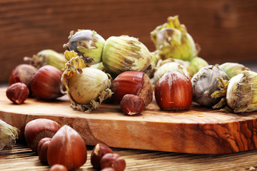 Wall Mural - hazelnut with shell and craked and hazelnut leaves.