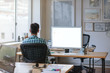 © mavoimages - Young designer working late at his desk in an office
