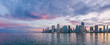Miami, wide panorama of urban skyline at beautiful sunset, vivid and dramatic sky