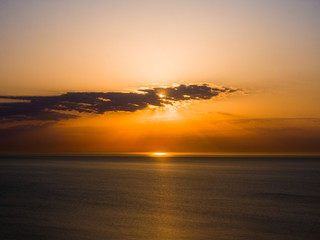 Wall Mural - beautiful sunrise photograph with vibrant orange and yellow colors over the dark waters of lake mich