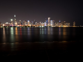 Wall Mural - beautiful long exposure chicago night skyline photo with colorful red, green, purple, blue, pink, or