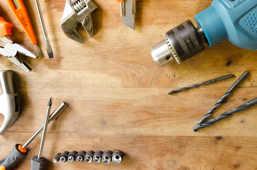 Set of tools on wooden background.